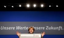 German Chancellor and leader of the conservative Christian Democratic Union party CDU Angela Merkel delivers her closing speech of the CDU party convention in Essen, Germany, December 7, 2016. REUTERS/Wolfgang Rattay