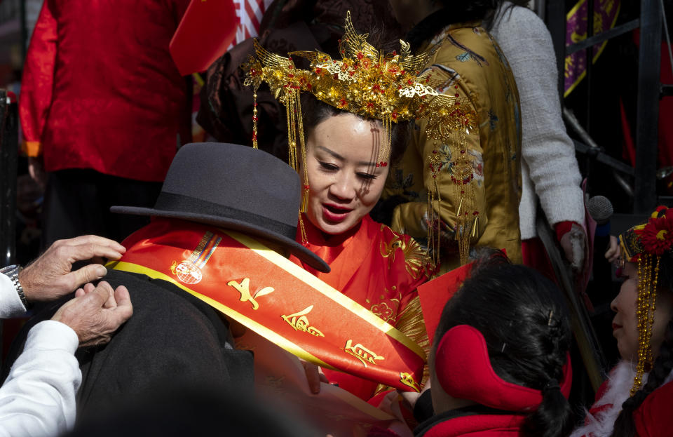 Participants get ready to march in the Lunar New Year parade in Chinatown in New York, Sunday, Feb. 9, 2020. (AP Photo/Craig Ruttle)