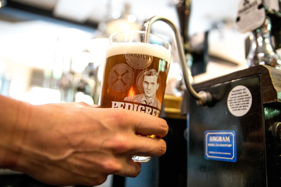 A person pouring a pint. Pubs are set to receive a £120 million boost from extra demand over the Coronation weekend (Carlsberg Marston’s Brewing/PA) (PA Media)