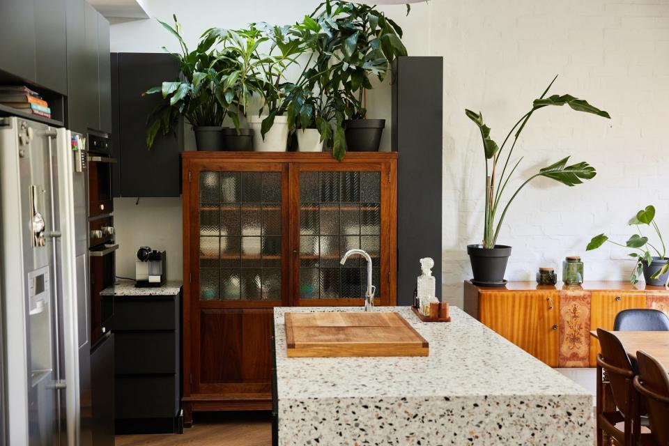<h1 class="title">Kitchen with a marble island in a modern home</h1><cite class="credit">Photo: Goodboy Picture Company/Getty Images</cite>