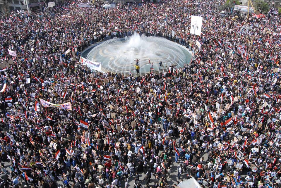 FILE - In this Tuesday, March 29, 2011 file photo, Pro-Syrian President Bashar Assad supporters gather to demonstrate their support for their president, in Damascus, Syria. It began innocently enough in March 2011, with a short phrase spray-painted on a schoolyard wall by teenagers in the southern Syrian city of Daraa: “Your turn is coming, doctor.” The doctor referred to President Bashar Assad, a trained ophthalmologist, and the implication was that he too would fall from power like his counterparts in Tunisia and Egypt who had recently been toppled in popular revolts. Nearly three years after the crisis began, Syria's government and opposition are set to meet in Geneva this week for the first direct talks aimed at ending the conflict. (AP Photo/Muzaffar Salman, File)