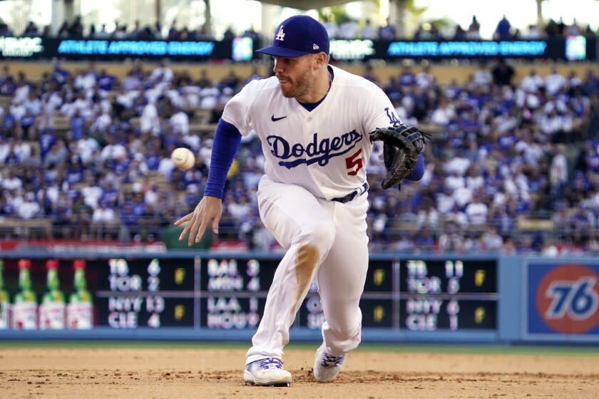 ADDS SEVENTH INNING - Los Angeles Dodgers first baseman Freddie Freeman makes a catch on a ball hit by San Diego Padres' Jurickson Profar during the seventh inning of a baseball game Saturday, July 2, 2022, in Los Angeles. Profar was out at first on the play. (AP Photo/Mark J. Terrill)