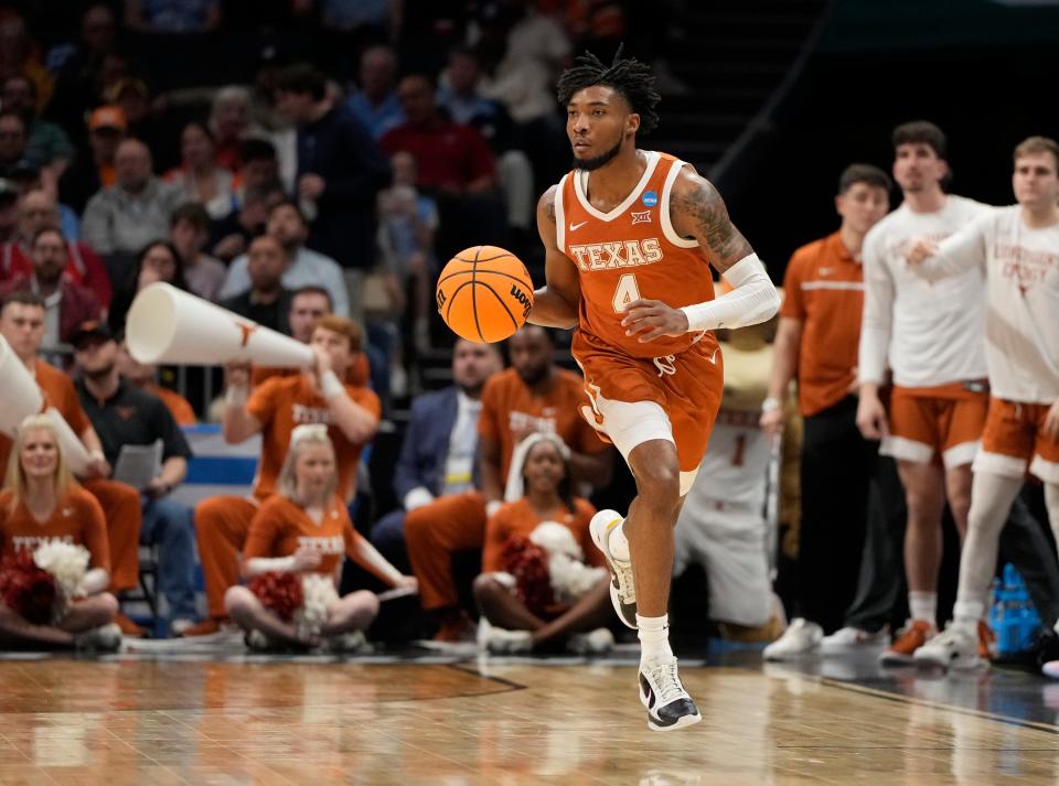 March 23, 2024, Charlotte, NC, USA; Texas Longhorns guard Tyrese Hunter (4) controls the ball against the Tennessee Volunteers in the second round of the 2024 NCAA Tournament at the Spectrum Center. Mandatory Credit: Bob Donnan-USA TODAY Sports