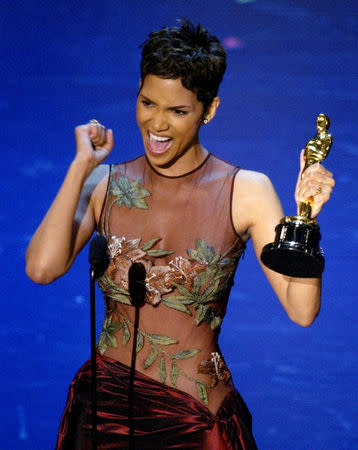 FILE PHOTO: Actress Halle Berry reacts to winning the Oscar for Best Actress during the 74th annual Academy Awards in Hollywood March 24, 2002. Berry won the Academy Award for her role in the film "Monster's Ball". REUTERS/Gary Hershorn/File Photo