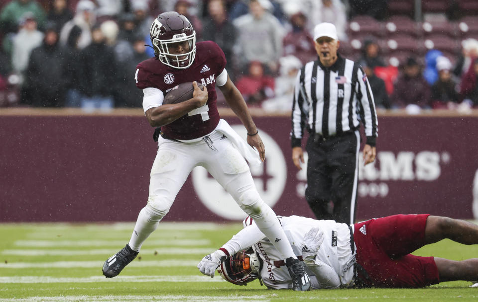 Nov 19, 2022; College Station, Texas; Texas A&M Aggies running back Amari Daniels (4) runs with the ball during the first quarter against the Massachusetts Minutemen at Kyle Field. Troy Taormina-USA TODAY Sports