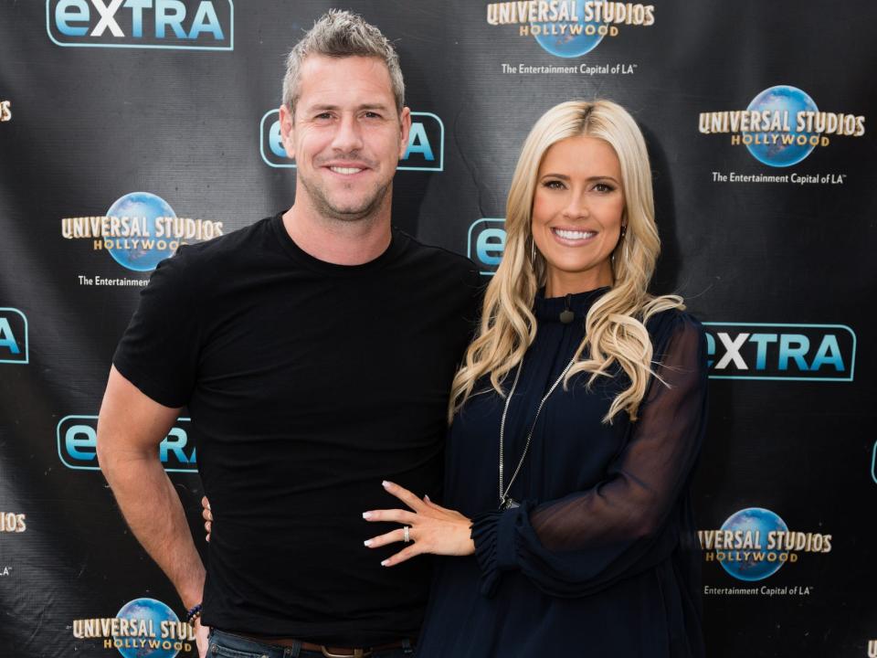 Ant Anstead and Christina Haack pose on a red carpet.
