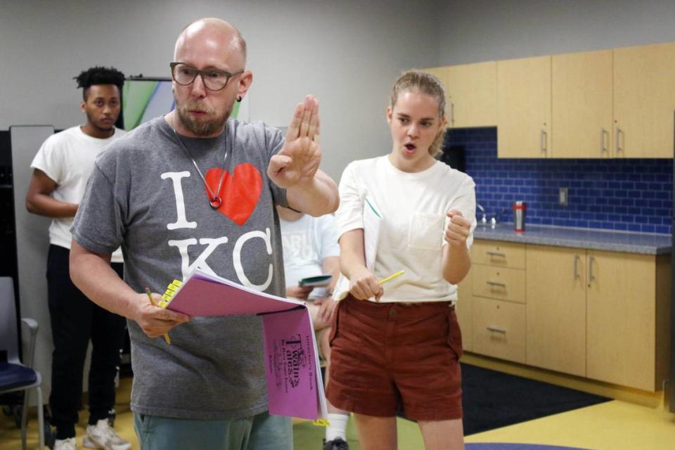 Director Jason Coats offers some tips to D.J. McKinney and Elizabeth Damon during a rehearsal for Theater on the Trail.