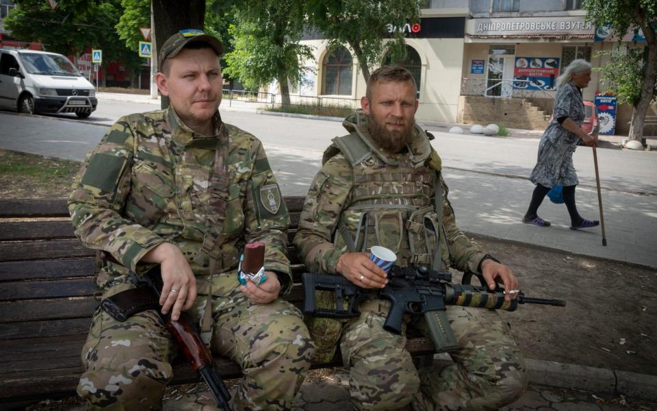 Ukrainian soldiers enjoy a short rest in Bakhmut, Donetsk region, Ukraine, Sunday, June 26, 2022. (AP Photo/Efrem Lukatsky)  - AP Photo/Efrem Lukatsky