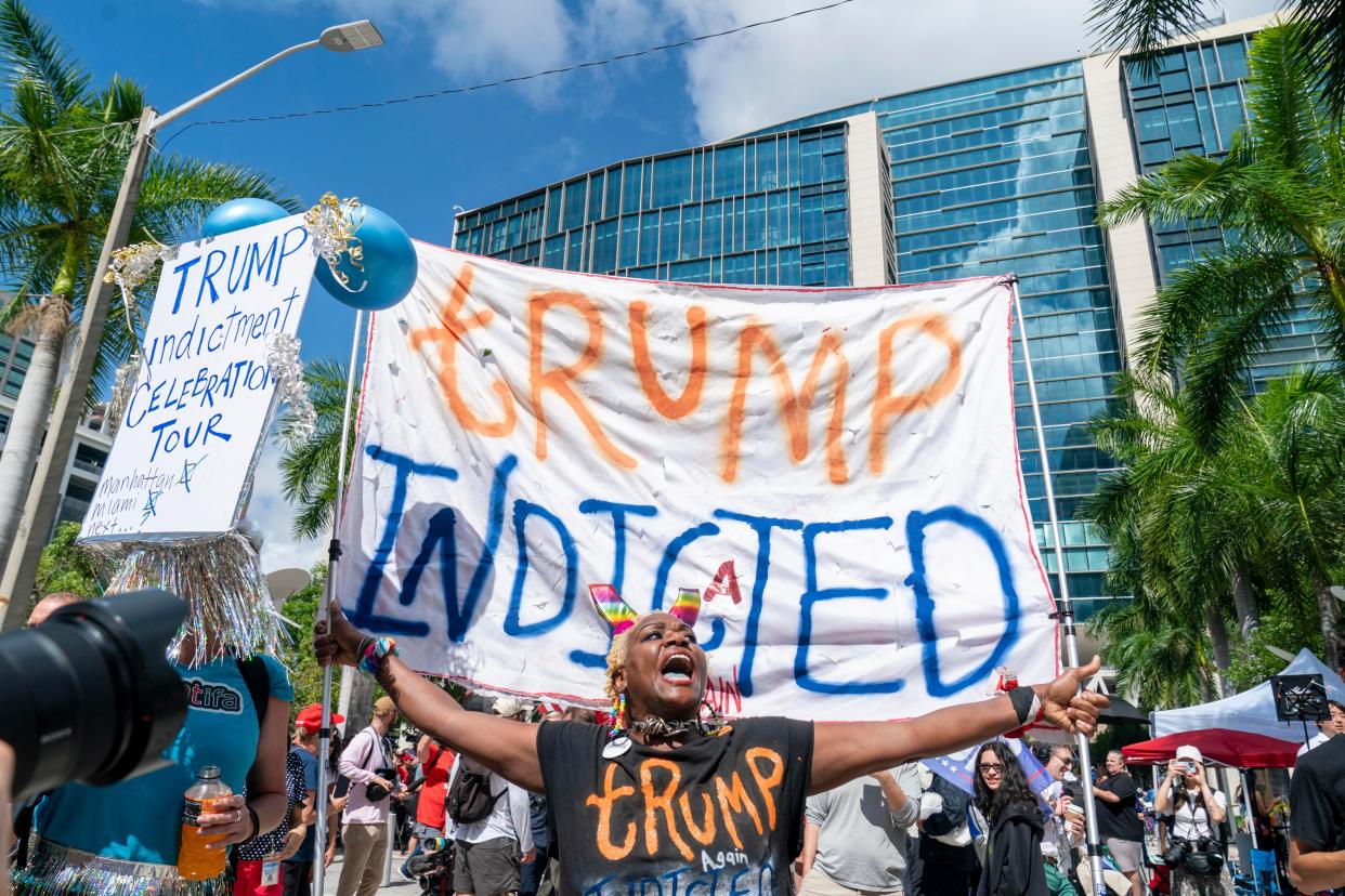 Nadine Seiler holds a sign outside the Wilkie D. Ferguson Jr. United States Federal Courthouse before the arraignment of former President Donald Trump on June 13, 2023 in Miami, Florida. 