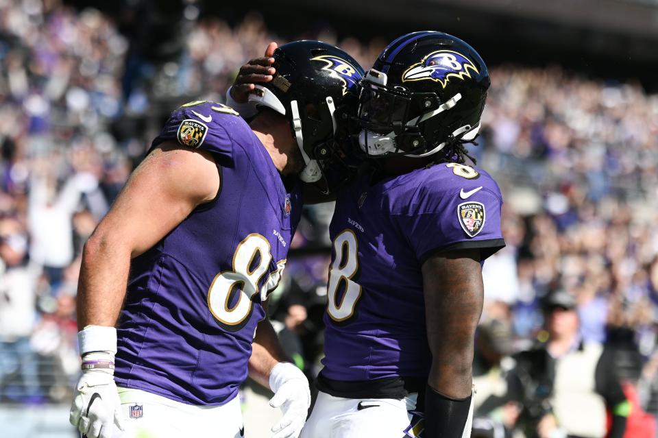 Baltimore Ravens tight end Mark Andrews (89) celebrates with quarterback Lamar Jackson (8) after socking a touchdown against the Detroit Lions at M&T Bank Stadium.