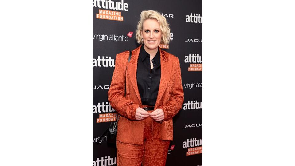 Steph McGovern in orange jacket and black shirt