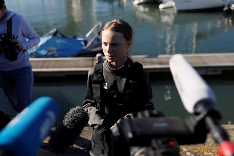 Climate change activist Greta Thunberg speaks upon her arrival at Santo Amaro port in Lisbon