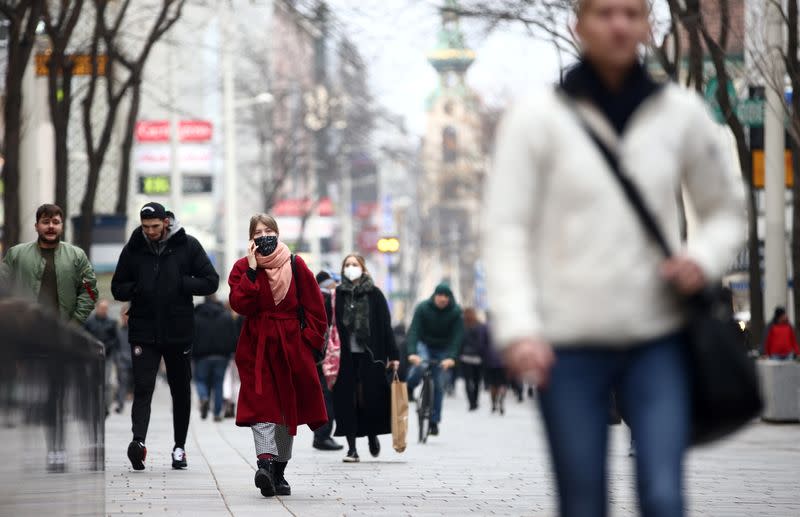 People with protective masks walk down a shopping street during the second lockdown as the coronavirus disease (COVID-19) outbreak continues in Vienna