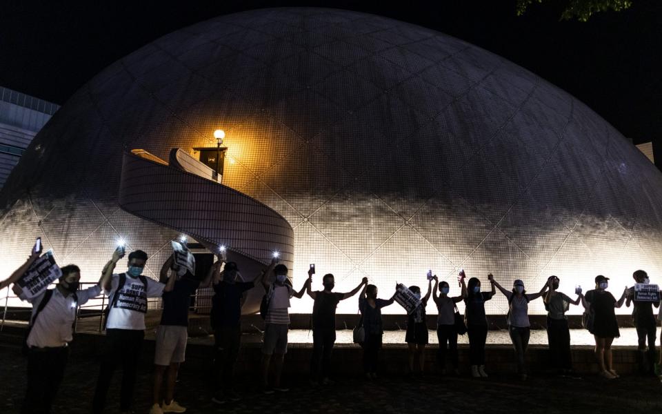 Demonstrators form a human chain ahead of the 12th weekend of protests - Bloomberg