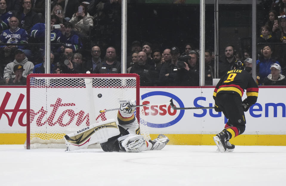 Vancouver Canucks' J.T. Miller, right, scores against Vegas Golden Knights goalie Jonathan Quick on a penalty shot during the second period of an NHL hockey game Tuesday, March 21, 2023, in Vancouver, British Columbia. (Darryl Dyck/The Canadian Press via AP)