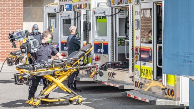 Paramedics work at The Ottawa Hospital's Civic campus on April 12, 2021. Ottawa's tally of COVID-19 hospitalizations topped 100 on Friday for the first time since the start of the pandemic. (Brian Morris/CBC - image credit)