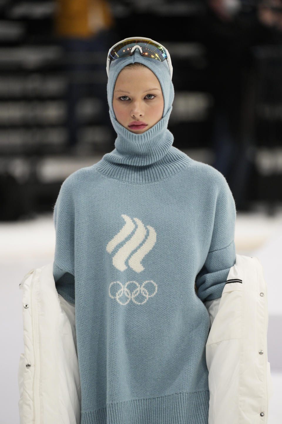 A model displays the Olympic uniforms for Russian athletes in Moscow, Russia, Friday, Dec. 10, 2021. Russia presents its Olympic kit for the Beijing Winter Olympics 2022, which shouldn't depict any symbols of the country. Russian athletes will compete at the Tokyo Olympics as neutral after the Court of Arbitration for Sport last December banned Russia from using its name, flag and anthem at any world championships because of state-backed doping. (AP Photo/Pavel Golovkin)