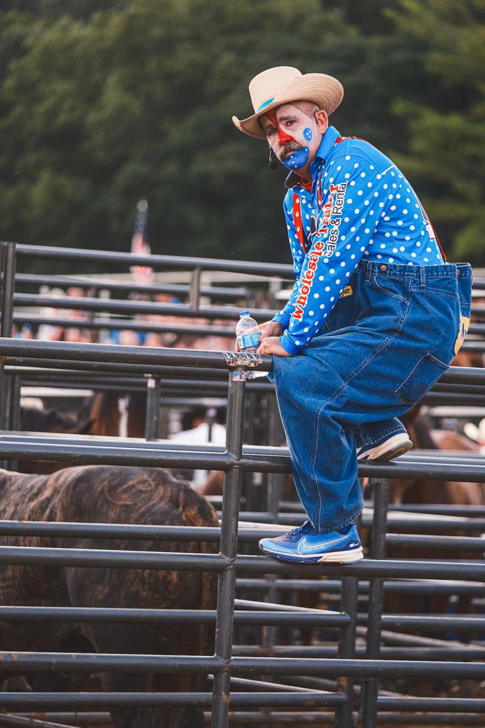 The rodeo clown climbs a fence during multiple comedy skits throughout the night at the Maury County Fair and Rodeo on Thursday, Aug. 31, 2023.