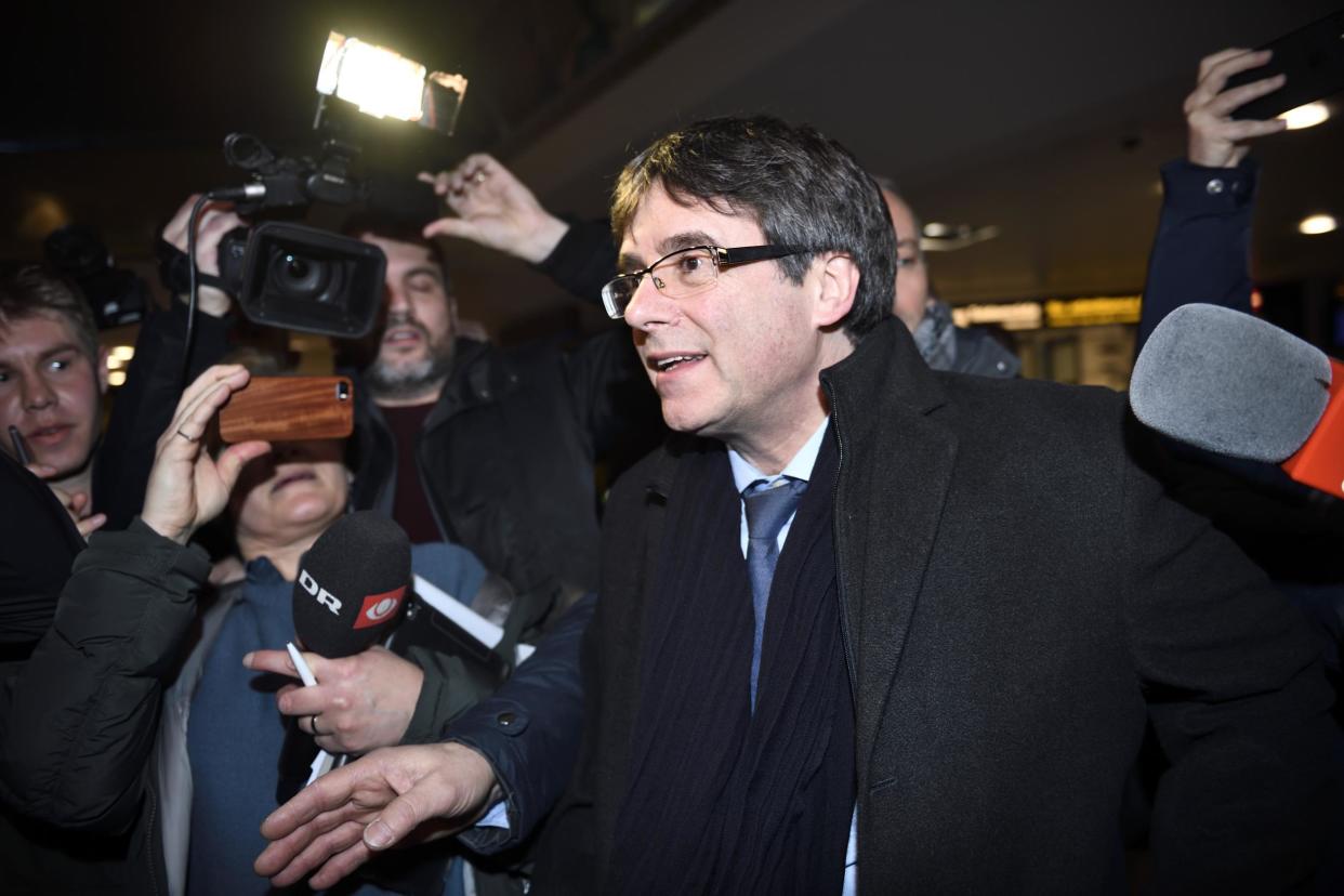 Former Catalan leader Carles Puigdemont is surrounded by journalists upon his arrival at Copenhagen Airport, Denmark, 22 January 2018: Getty