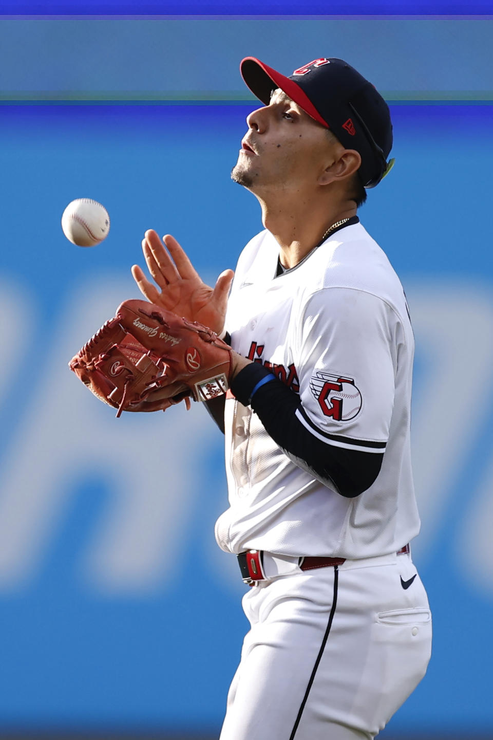 Cleveland Guardians second baseman Andrés Giménez makes a catch to get out Chicago White Sox's Nicky Lopez during the fifth inning of a baseball game, Monday, April 8, 2024, in Cleveland. (AP Photo/Ron Schwane)