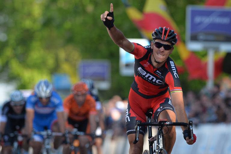 Belgian Philippe Gilbert of BMC Racing Team celebrates as he crosses the finish line to win the 54rth edition of the Brabantse Pijl one-day cycling race, 203.1 km from Leuven to Overijse, on April 16, 2014