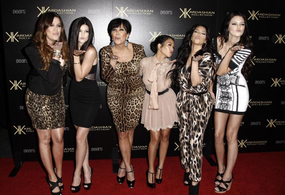 FILE - In this Aug. 17, 2011 file photo, from left, Khloe Kardashian, Kylie Jenner, Kris Jenner, Kourtney Kardashian, Kim Kardashian, and Kendall Jenner arrive at the Kardashian Kollection launch party in Los Angeles. The E! Entertainment network said Tuesday it had reached a deal with its most bankable franchise to make three more seasons of "Keeping Up With the Kardashians." (AP Photo/Matt Sayles, file)