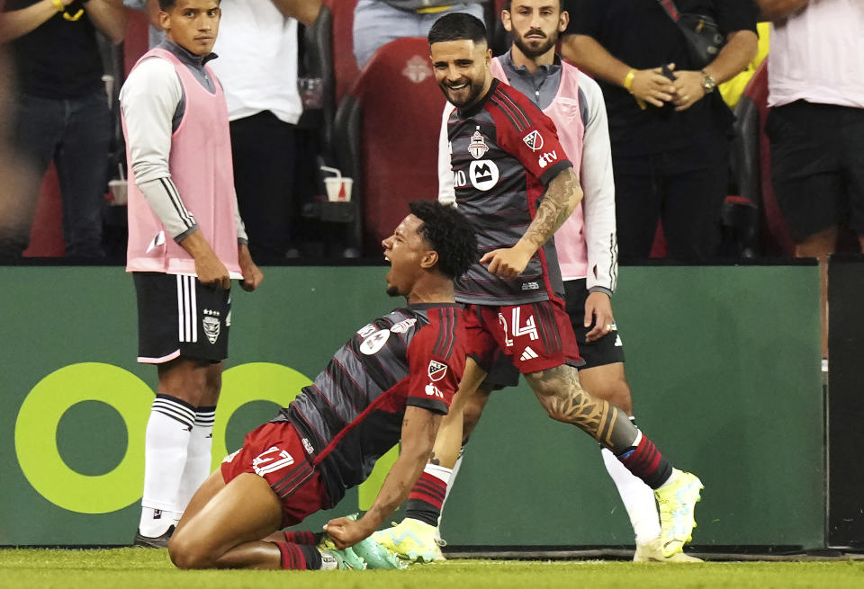 Toronto FC midfielder Kosi Thompson (47) celebrates after his goal against D.C. United with teammate Lorenzo Insigne (24) during second-half MLS soccer match action in Toronto, Ontario, Saturday, May 27, 2023. (Chris Young/The Canadian Press via AP)