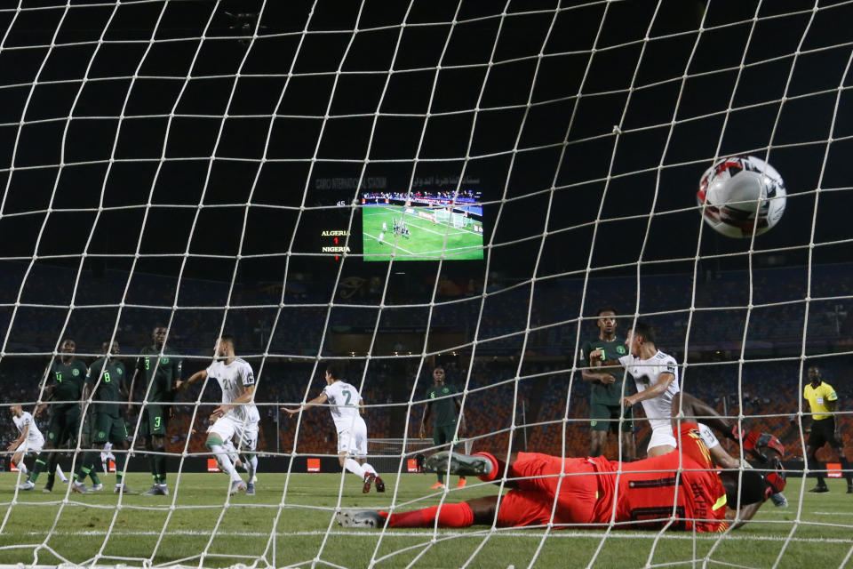 Algeria's Riyad Mahrez scores the winning goal during the African Cup of Nations semifinal soccer match between Algeria and Nigeria in Cairo International stadium in Cairo, Egypt, Sunday, July 14, 2019. Algeria won 2-1. (AP Photo/Ariel Schalit)