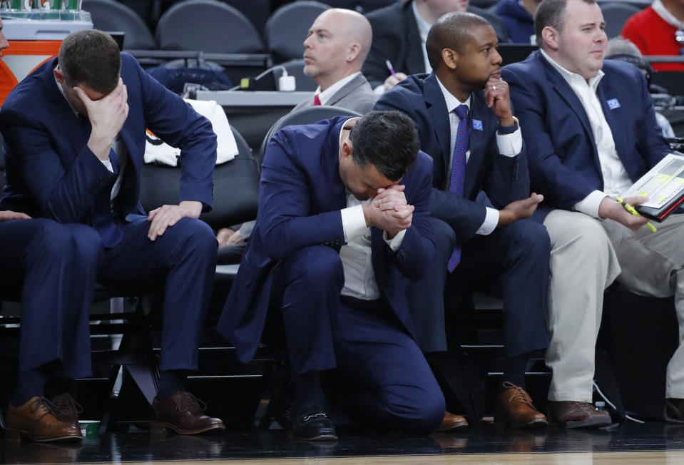 Arizona's head coach Sean Miller, center, reacts after a play against Southern California during the second half of an NCAA college basketball game in the first round of the Pac-12 men's tournament Wednesday, March 13, 2019, in Las Vegas. (AP Photo/John Locher)