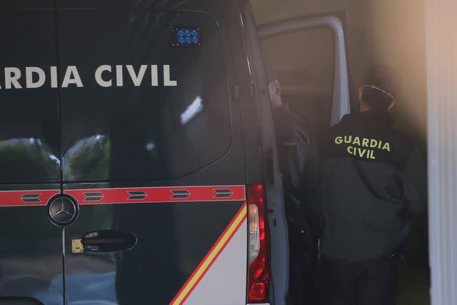 <p>Europa Press/AP</p> A Guardia Civil takes Cesar Roman Viruete out of a police van to testify in a trial held at the Provincial Court of Madrid on May 12, 2021.
