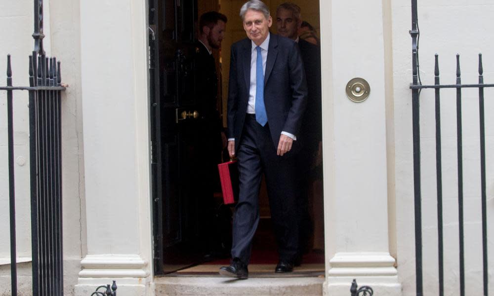 Philip Hammond holds the famous red box on the steps of N0 11 Downing Street