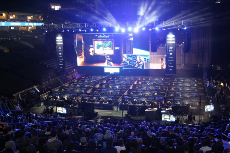 Fans watch as 80 players simultaneously fight for survival in an eSports match of upstart computer game "PlayUnknown's Battlegrounds" at an Intel Extreme Masters tournament in the Oracle Arena in Oakland, California on November 18, 2017