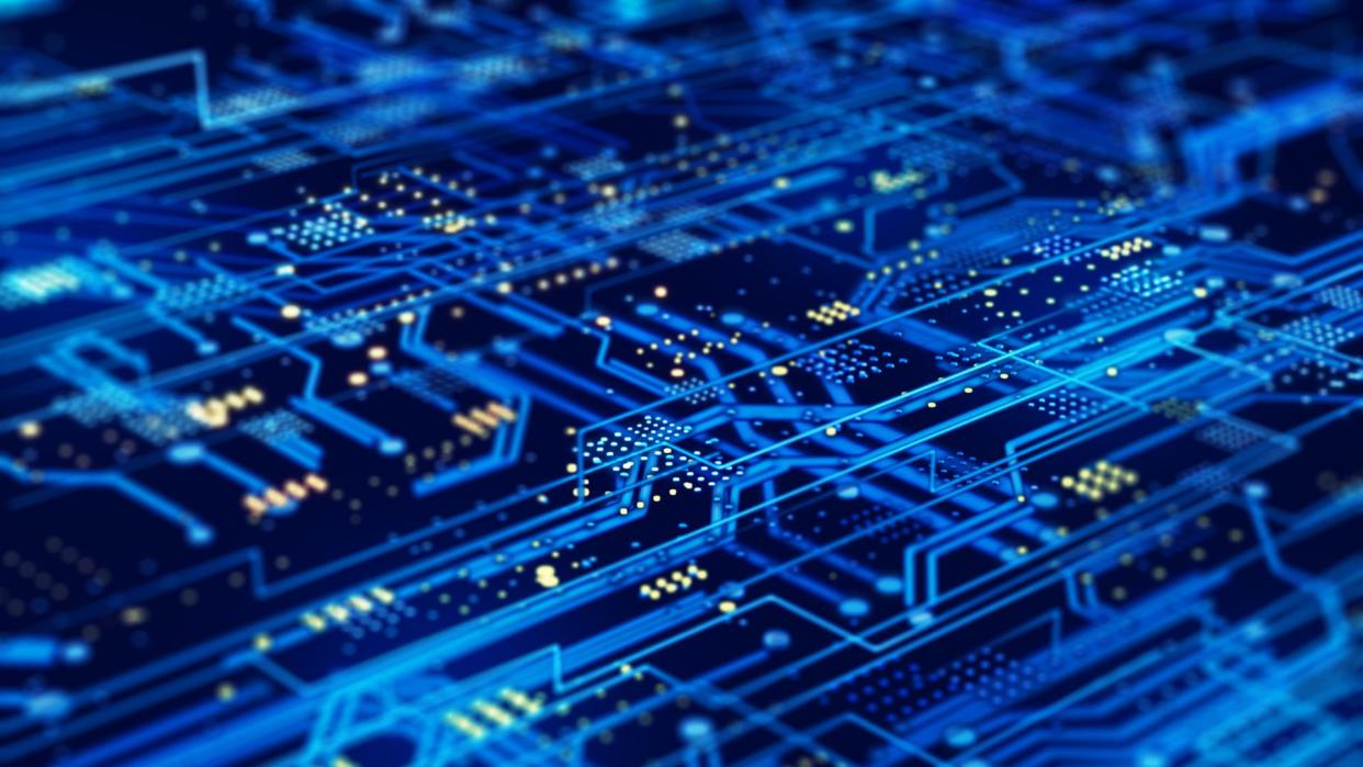  A futuristic circuit board on a dark blue background. 