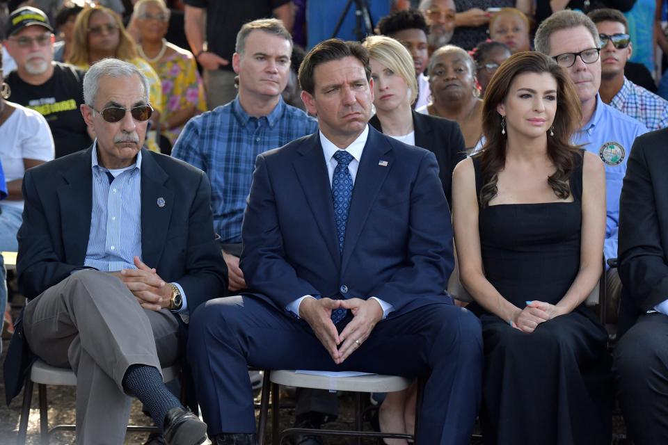 Florida Governor Ron DeSantis flanked by Jacksonville city council president Ron Salem and his wife Casey DeSantis as they take part in the prayer vigil Sunday evening.