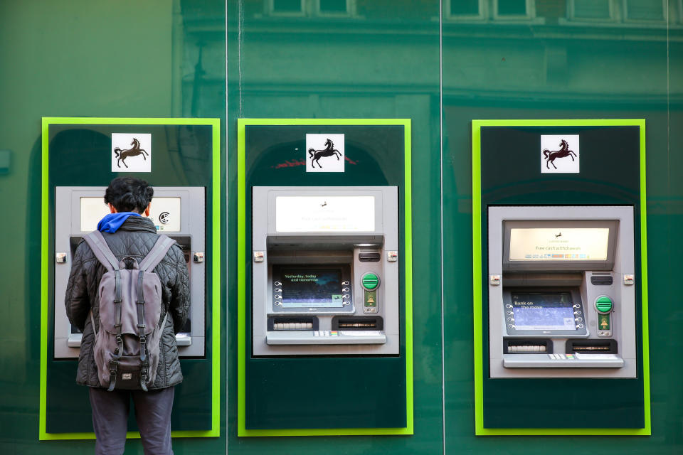 LONDON, UNITED KINGDOM - 2019/12/04: A man using Lloyds Bank's ATM machine in London's West End. (Photo by Dinendra Haria/SOPA Images/LightRocket via Getty Images)