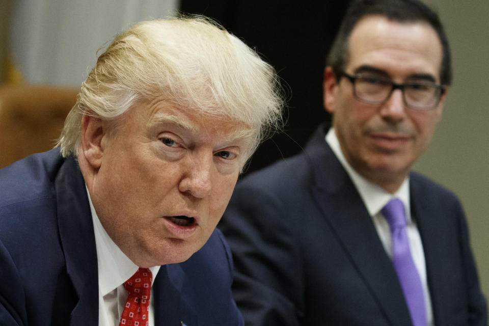 <p> Treasury Secretary Steven Mnuchin listens at right as President Donald Trump speaks during a meeting on the Federal budget, Wednesday, Feb. 22, 2017, in the Roosevelt Room of the White House in Washington. (AP Photo/Evan Vucci) </p>