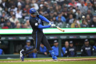 Detroit Tigers' Mark Canha hits a grand slam against the Houston Astros in the second inning of a baseball game, Saturday, May 11, 2024, in Detroit. (AP Photo/Paul Sancya)