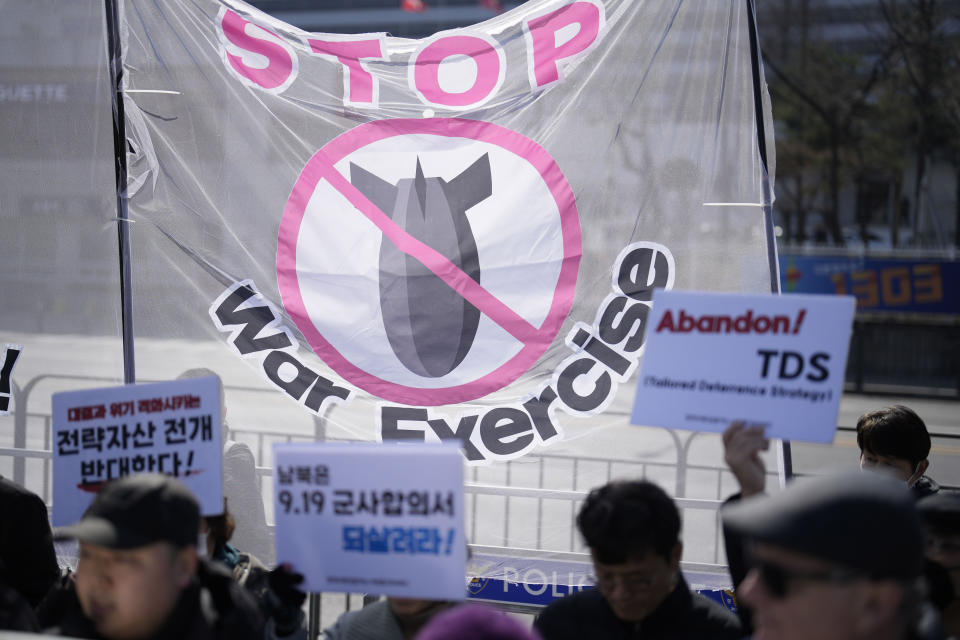 Protesters hold signs during a rally demanding to stop the joint military exercises between the U.S. and South Korea, in Seoul, South Korea, Monday, March 4, 2024. South Korea and the United States began large annual military exercises Monday to bolster their readiness against North Korean nuclear threats after the North raised animosities with an extension of missile tests and belligerent rhetoric earlier this year. (AP Photo/Lee Jin-man)