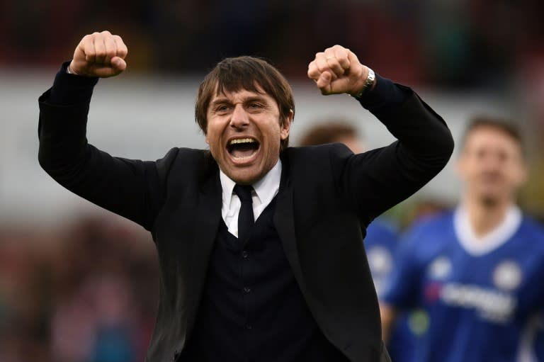 Chelsea's manager Antonio Conte celebrates after winning their English Premier League match against Stoke City, at the Bet365 Stadium in Stoke-on-Trent, on March 18, 2017