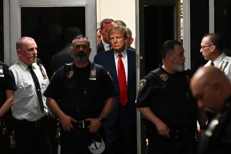 Former President Donald Trump departs a New York State court after appearing for an arraignment in April after he was indicted by a grand jury on more than 30 counts related to business fraud. File Photo by Louis Lanzano/UPI