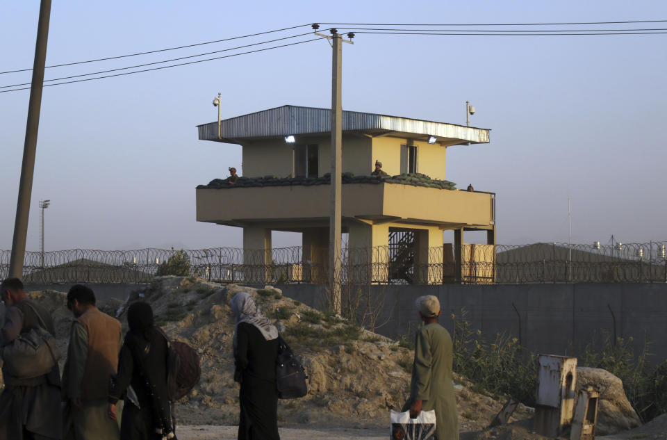 U.S soldiers stand guard at the airport tower near an evacuation control checkpoint during ongoing evacuations at Hamid Karzai International Airport, in Kabul, Afghanistan, Wednesday, Aug. 25, 2021. The Taliban wrested back control of Afghanistan nearly 20 years after they were ousted in a U.S.-led invasion following the 9/11 attacks. Their return to power has pushed many Afghans to flee, fearing reprisals from the fighters or a return to the brutal rule they imposed when they last ran the country. (AP Photo)