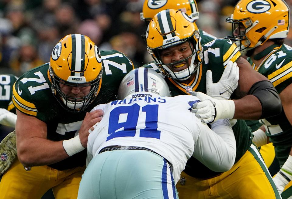 Green Bay Packers center Josh Myers (71) and guard Elgton Jenkins (74) double team Dallas Cowboys defensive end Carlos Watkins (91) during their game Sunday, November 13, 2022 at Lambeau Field in Green Bay, Wis. The Green Bay Packers beat the Dallas Cowboys 31-28 in overtime.