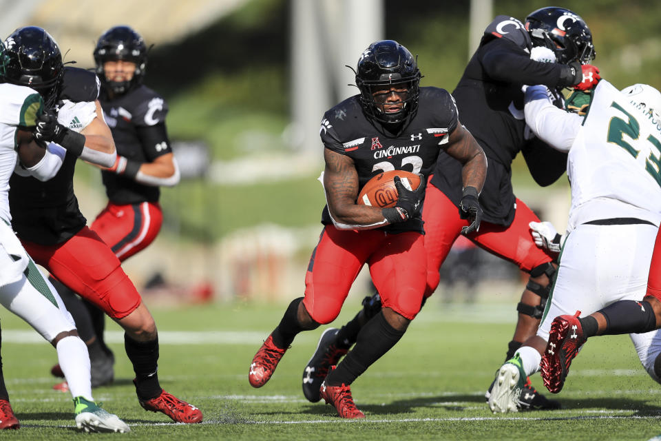 Cincinnati running back Gerrid Doaks carries the ball during the first half of an NCAA college football game against South Florida, Saturday, Oct. 3, 2020, in Cincinnati. (AP Photo/Aaron Doster)