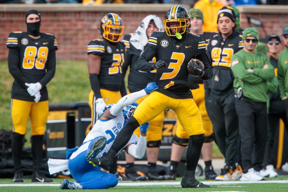 Nov 5, 2022; Columbia, Missouri, USA; Missouri Tigers wide receiver Luther Burden III (3) tries to break a tackle by Kentucky Wildcats defensive back Andru Phillips (23) during the fourth quarter at Faurot Field at Memorial Stadium. Mandatory Credit: William Purnell-USA TODAY Sports