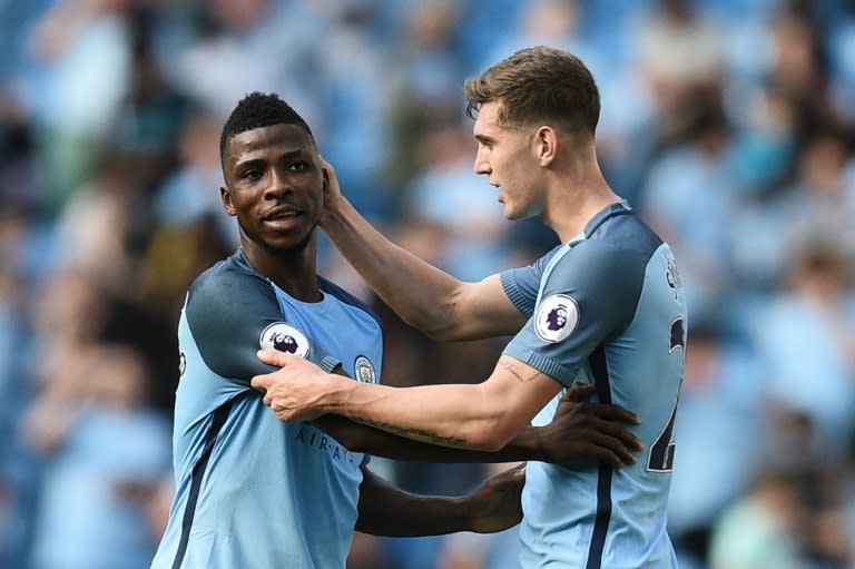 Manchester City's Kelechi Iheanacho (L) and John Stones celebrate at the end of their English Premier League match against Bournemouth, at the Etihad Stadium in Manchester, on September 17, 2016