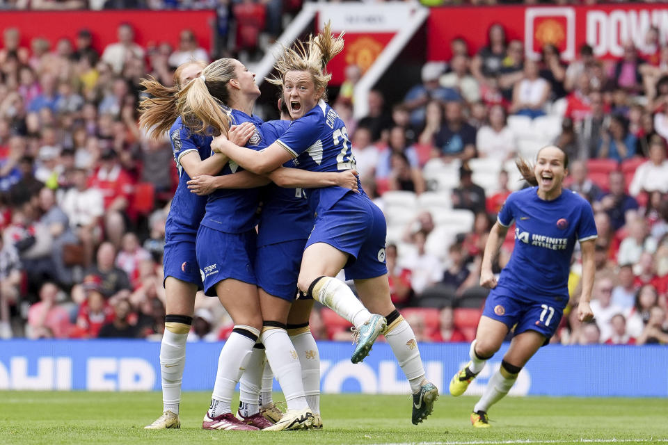 Chelsea's Melanie Leupolz, second left, celebrates after scoring their side's fifth goal of the game, during the English Women's Super League soccer match between Manchester United and Chelsea at Old Trafford, in Manchester, England, Saturday May 18, 2024. (Martin Rickett/PA via AP)