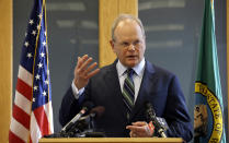 In this March 14, 2017, file photo, King County Prosecutor Dan Satterberg speaks at a news conference in Seattle. Auburn police Officer Jeffrey Nelson has been charged in the 2019 shooting of Jesse Sarey, and has been investigated in more than 60 use-of-force cases since 2012, but he wasn't on the prosecutor's "potential impeachment disclosure" list, or Brady List, which flags officers whose credibility is in question due to misconduct, until after being charge in Sarey's death. An Associated Press investigation based on hundreds of documents and interviews with prosecutors, defense attorneys and experts on police reform found that prosecutors do not always used the lists to ensure accountability. (AP Photo/Elaine Thompson, File)