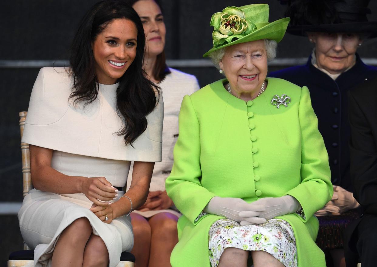 Queen Elizabeth II is all smiles alongside Meghan, Duchess of Sussex during a ceremony to open the new Mersey Gateway Bridge on June 14, 2018 in the town of Widnes in Halton, Cheshire, England. Meghan Markle married Prince Harry in May 2018 and became The Duchess of Sussex.