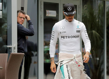 Formula One - Russian Grand Prix - Sochi, Russia - 30/4/16 - Mercedes F1 driver Lewis Hamilton walks to the garage before the third practice session. REUTERS/Maxim Shemetov