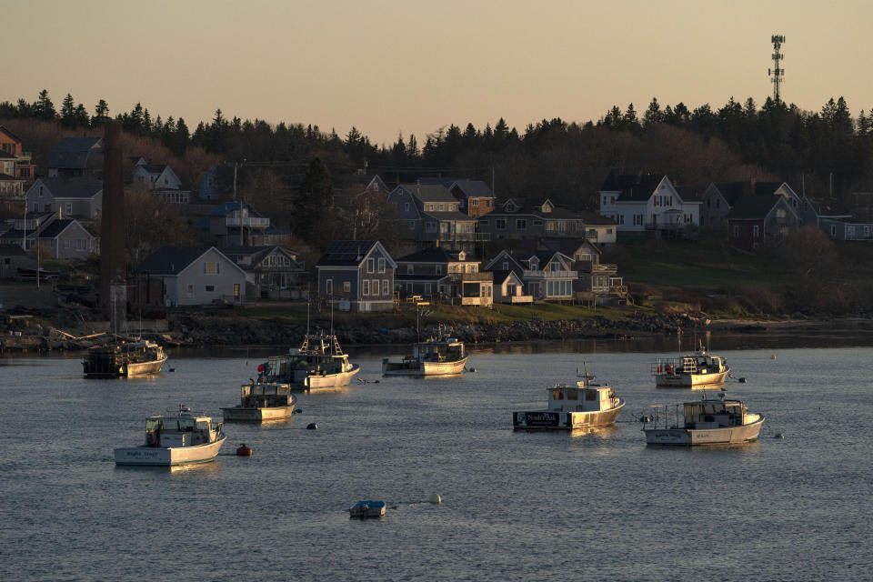 Lobster boats sit at their moorings in Jonesport, Maine, Friday, April 28, 2023. The fishing industry is a major employer in the rural area where a local family wants to build the world's tallest flagpole. (AP Photo/Robert F. Bukaty)